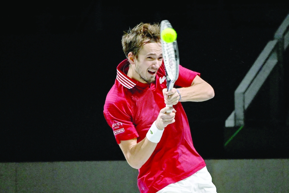 Russia's Daniil Medvedev returns the ball to Germany's Jan-Lennard Struff during the men's singles semifinal against Germany in the Davis Cup. -- AFP