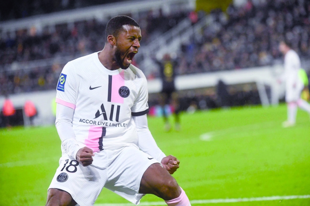 Paris Saint-Germain's Georginio Wijnaldum celebrates after scoring during the French L1 match against RC Lens. -- AFP