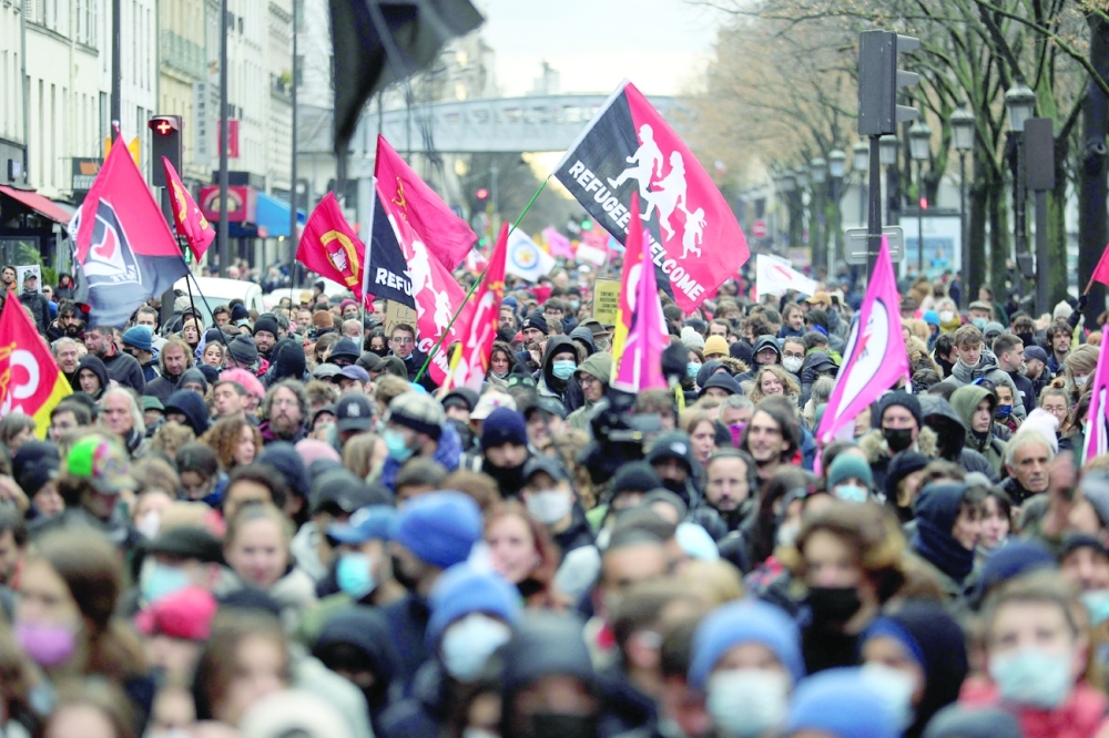 Demonstrators march during a rally to protest against French far-right presidential candidate Eric Zemmour in Paris on the day of his first official campaign rally. - AFP