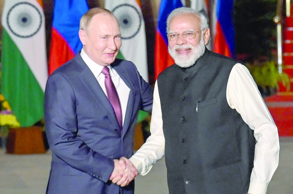 India's Prime Minister Narendra Modi greets Russian President Vladimir Putin in New Delhi. - AFP

