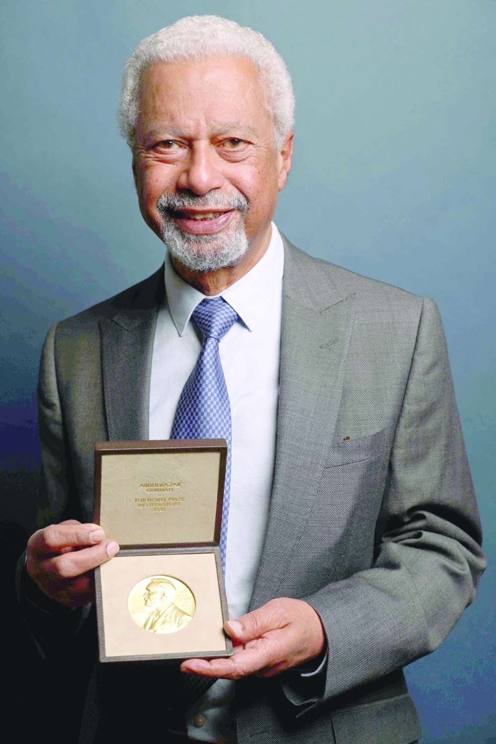 British novelist Abdulrazak Gurnah poses with his Nobel medal during a ceremony in London. - AFP