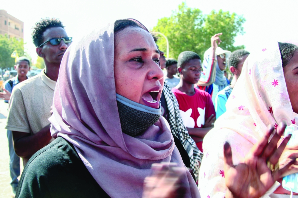 Sudanese women chant slogans as they rally in Khartoum to protest a deal that saw the Prime Minister reinstated after his ouster in a military coup in October. - AFP