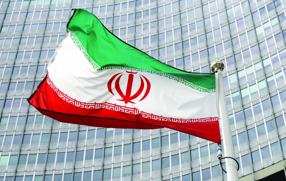 FILE PHOTO: An Iranian flag flutters in front of the IAEA headquarters in Vienna