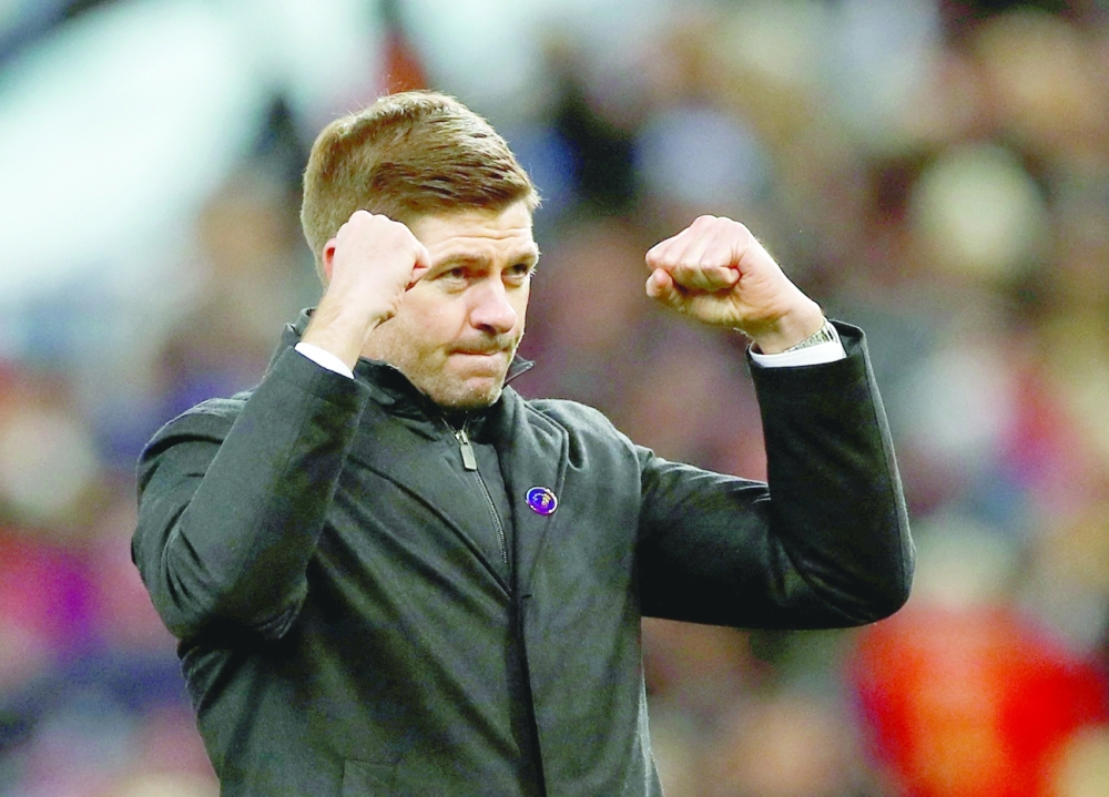 Aston Villa manager Steven Gerrard celebrates after the match. -- Reuters