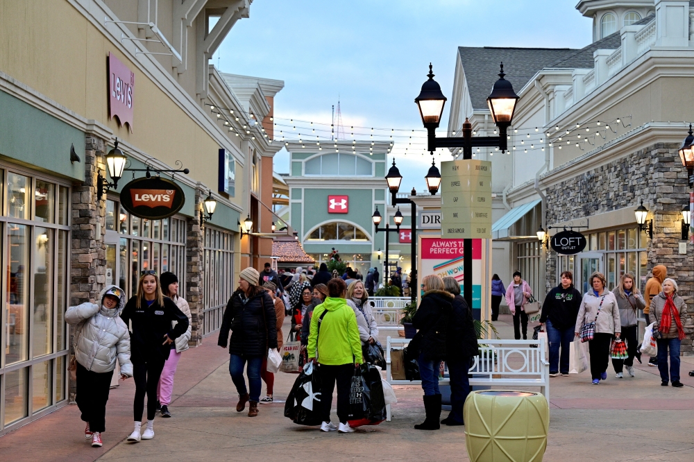 Shoppers walk around a shopping area as in Simpsonville, Kentucky
