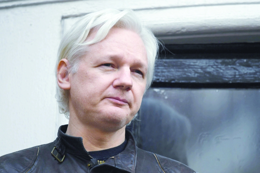 (FILES) In this file photo taken on May 19, 2017, Wikileaks founder Julian Assange speaks on the balcony of the Embassy of Ecuador in London. The US government on Friday won an appeal against a London court ruling that had blocked the extradition of WikiLeaks founder Julian Assange from Britain. (Photo by Justin TALLIS / AFP)
