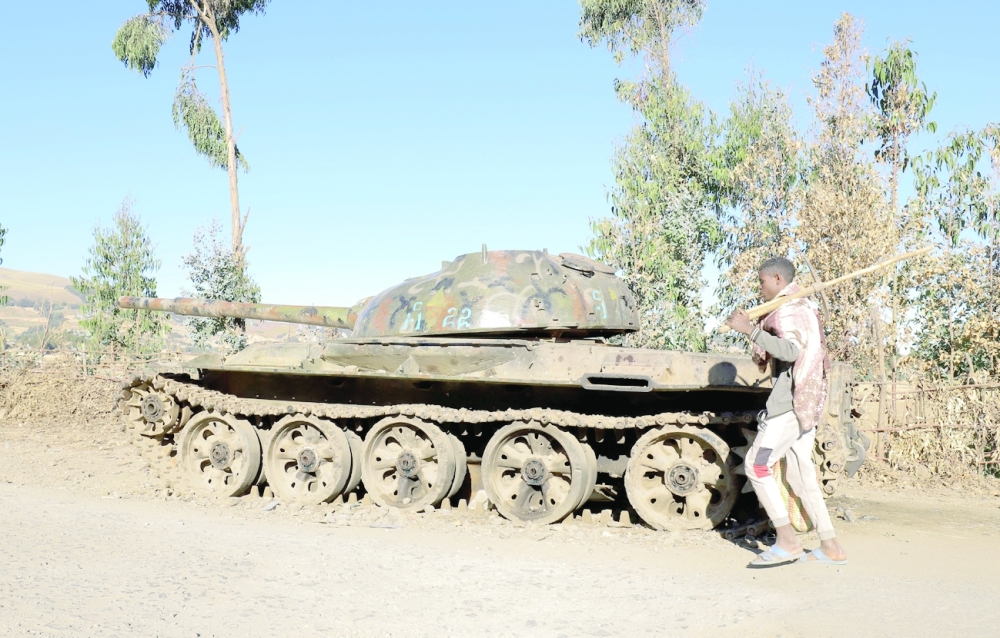 A  farmer walks past a military tank destroyed recently during fighting between the Ethiopian National Defense Force and the Tigray People's Liberation Front in Damot Kebele of Amhara region. -- Reuters