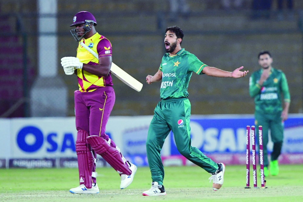 Pakistan's Haris Rauf (C) celebrates after the dismissal of West Indies' Oshane Thomas (L) during the second T20I at the National Stadium in Karachi. -- AFP

