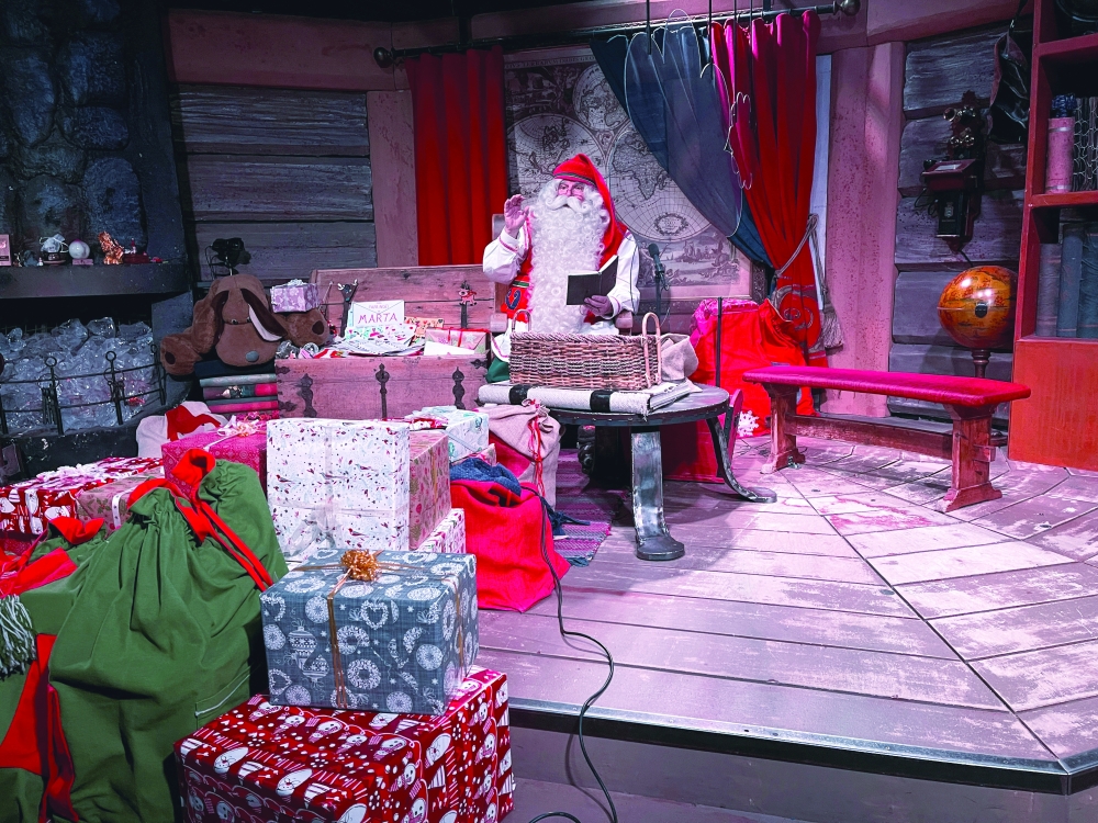 A man dressed as Santa Claus is pictured in his chamber at the Santa Claus Village in the Arctic Circle near Rovaniemi, Finland. — Reuters