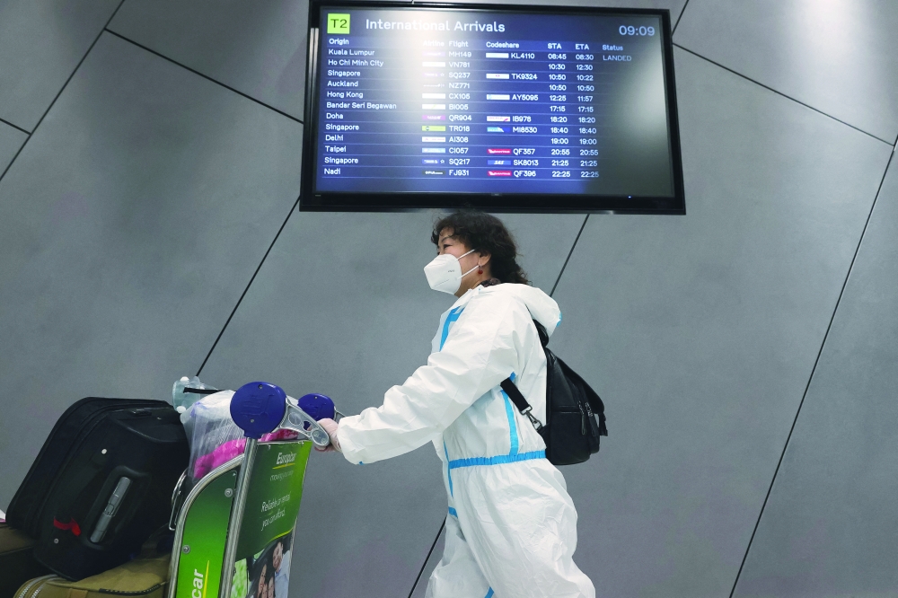 Passenger arrives at Melbourne International Airport. -- Reuters