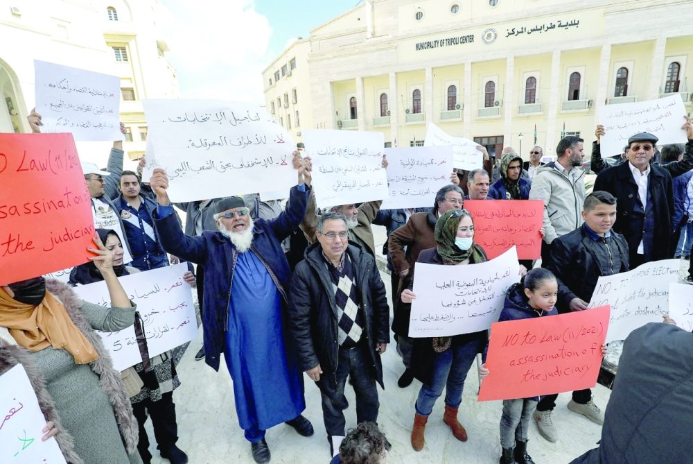 Libyans gather outside the Tripoli Municipality to protest against any possible postponement of the upcoming elections scheduled for December 24.  -- AFP

