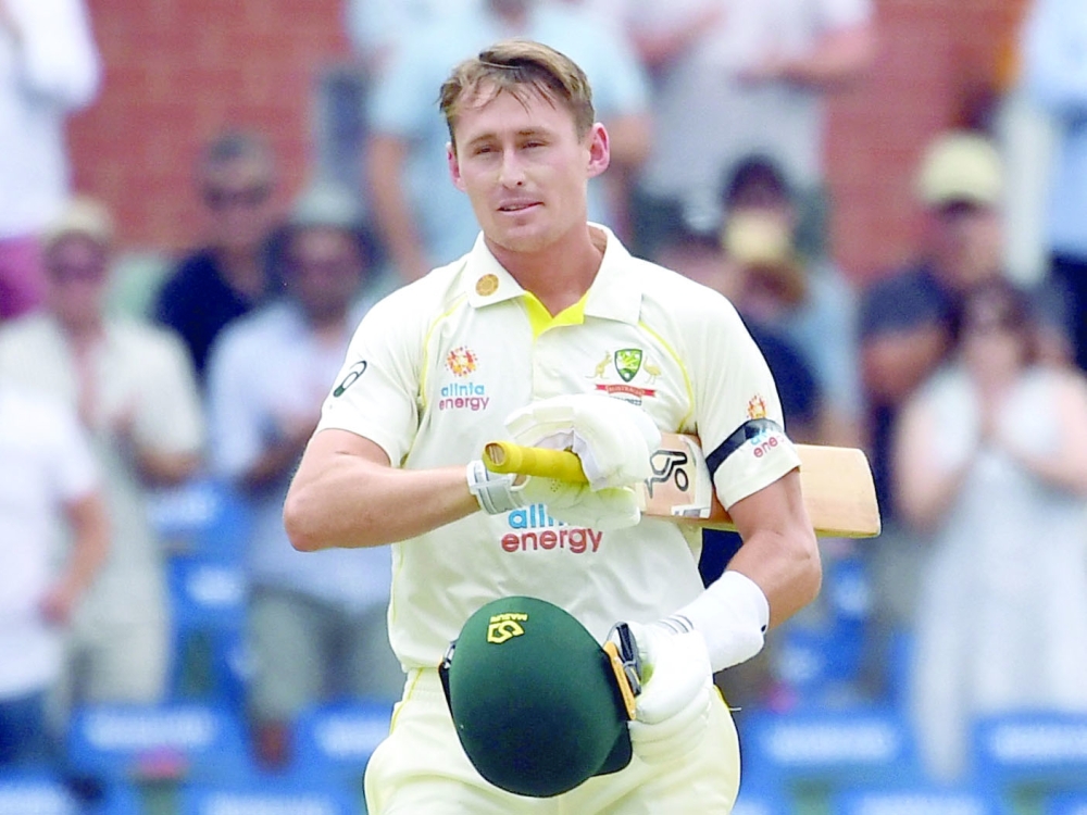 Australia's Marnus Labuschagne reacts after reaching his century. -- Reuters