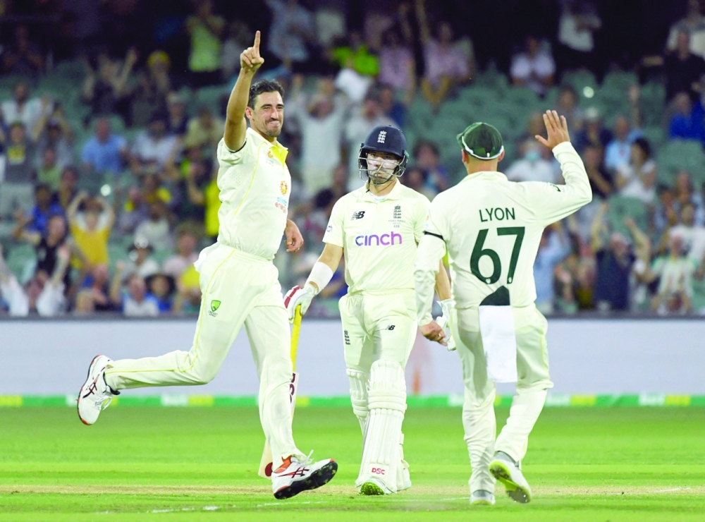 Australia's Mitchell Starc celebrates taking the wicket of England's Rory Burns. -- Reuters