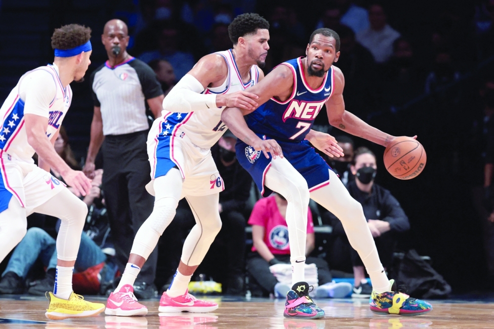 Brooklyn Nets forward Kevin Durant (7) dribbles as Philadelphia 76ers forward Tobias Harris (12) defends during the first half at Barclays Center. -- USA Today Sports
