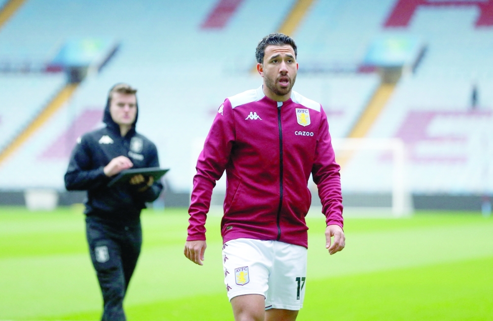Aston Villa's Trezeguet on the pitch after the match was postponed due to Covid-19. -- Reuters