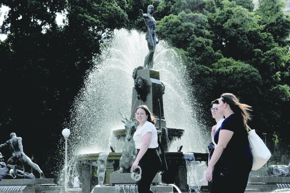 People visit Hyde Park in Sydney. — AFP   