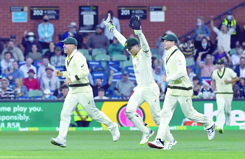 Australia players celebrates taking the wicket of England's Dawid Malan. -- Reuters