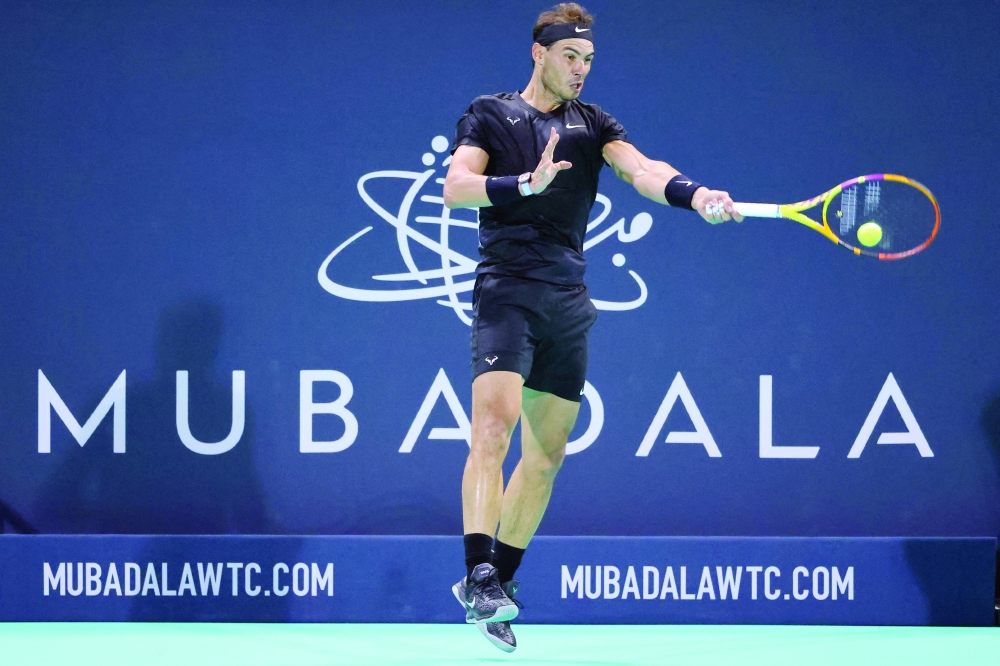 Spain's Rafael Nadal returns the ball to Canada's Denis Shapovalov (unseen). -- AFP