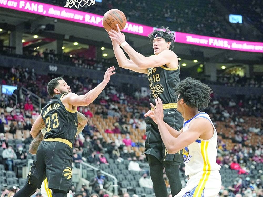 Toronto Raptors' Yuta Watanabe (18) comes down with rebound against the Golden State Warriors at Scotiabank Arena. -- USA Today Sports
