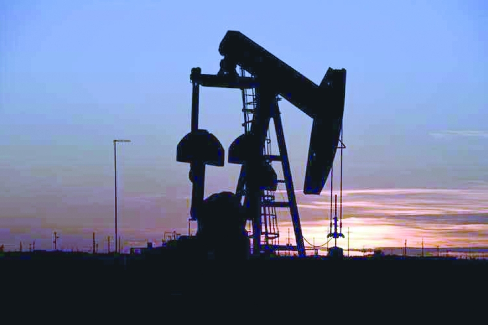 A pump jack operates at sunset in an oil field in Midland, Texas. — Reuters
