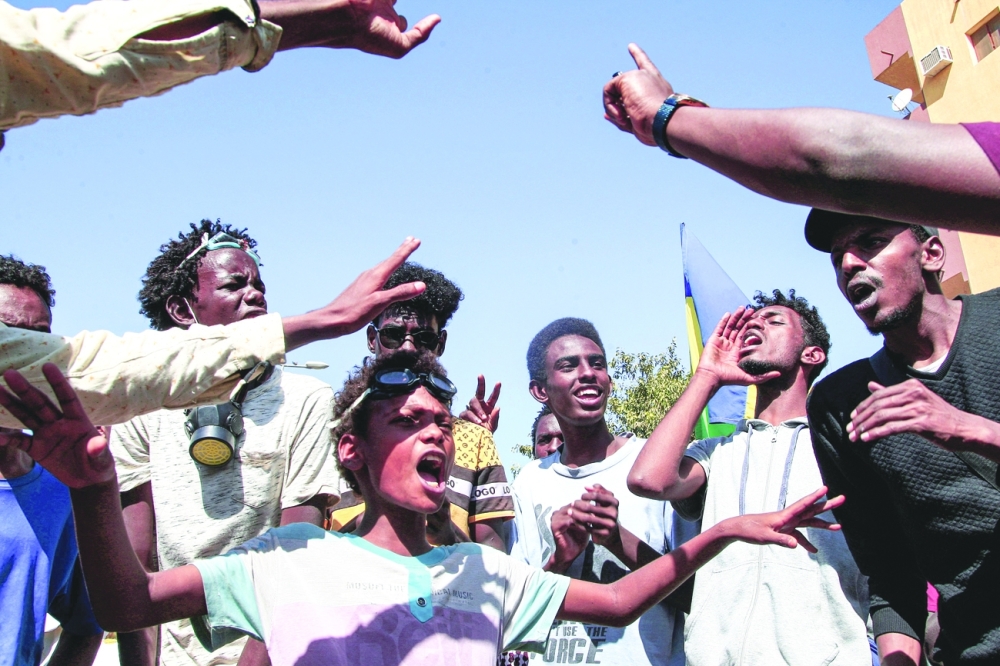 Protesters chant slogans during a mass demonstration demanding civilian rule, in the Sahafa neighbourhood in Khartoum on Saturday. — AFP 
