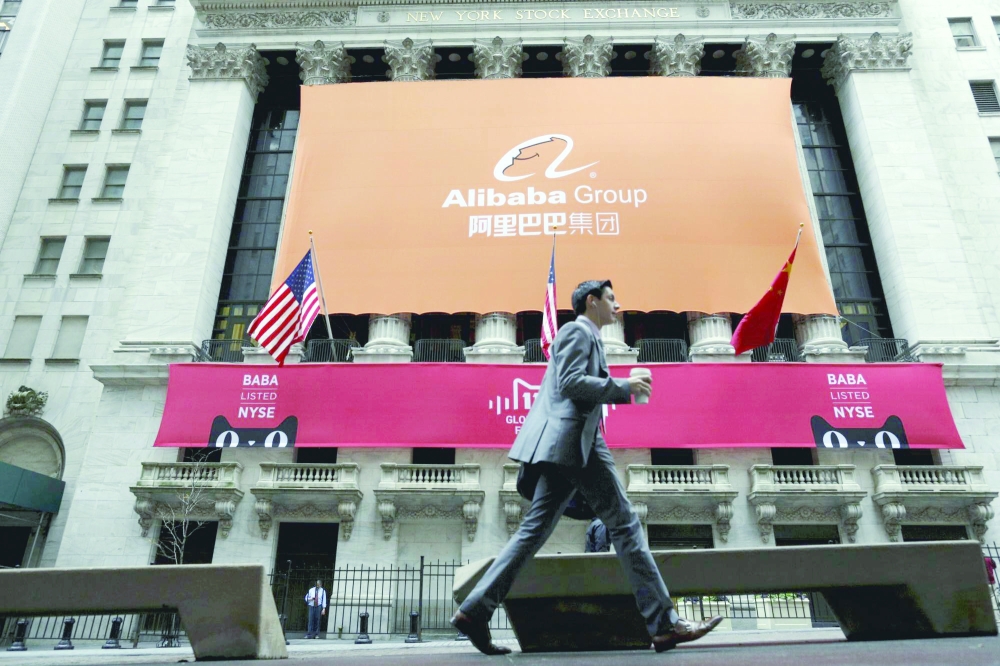 Signage for Alibaba Group Holding Ltd. covers the front facade of the New York Stock Exchange, in this file photo. — Reuters