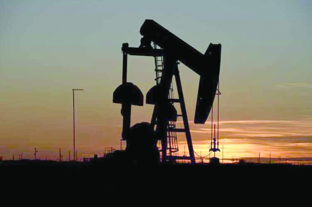 A pump jack operates at sunset in an oil field in Midland, Texas. — Reuters