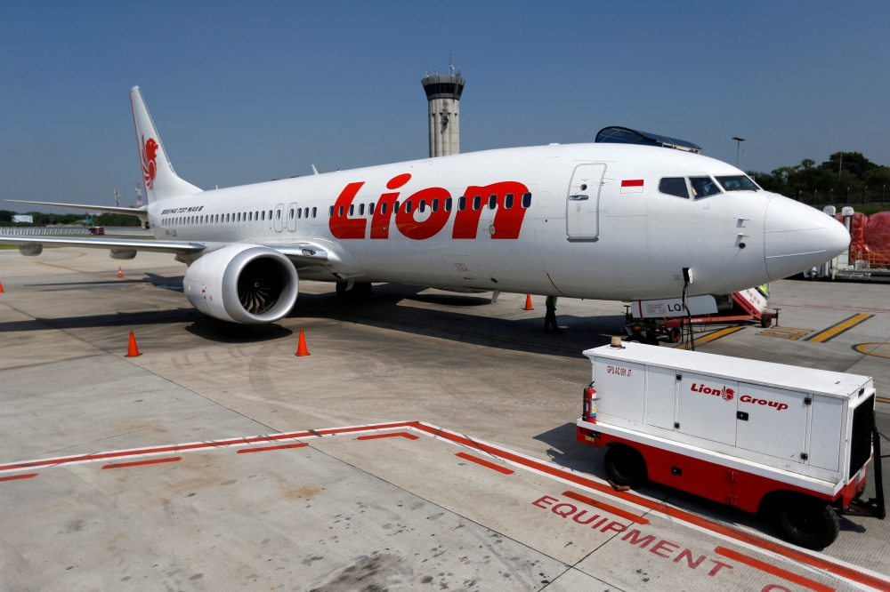 FILE PHOTO: A Lion Air Boeing 737 Max 8 airplane is parked on the tarmac of Soekarno Hatta International airport near Jakarta, Indonesia, on March 15, 2019. 