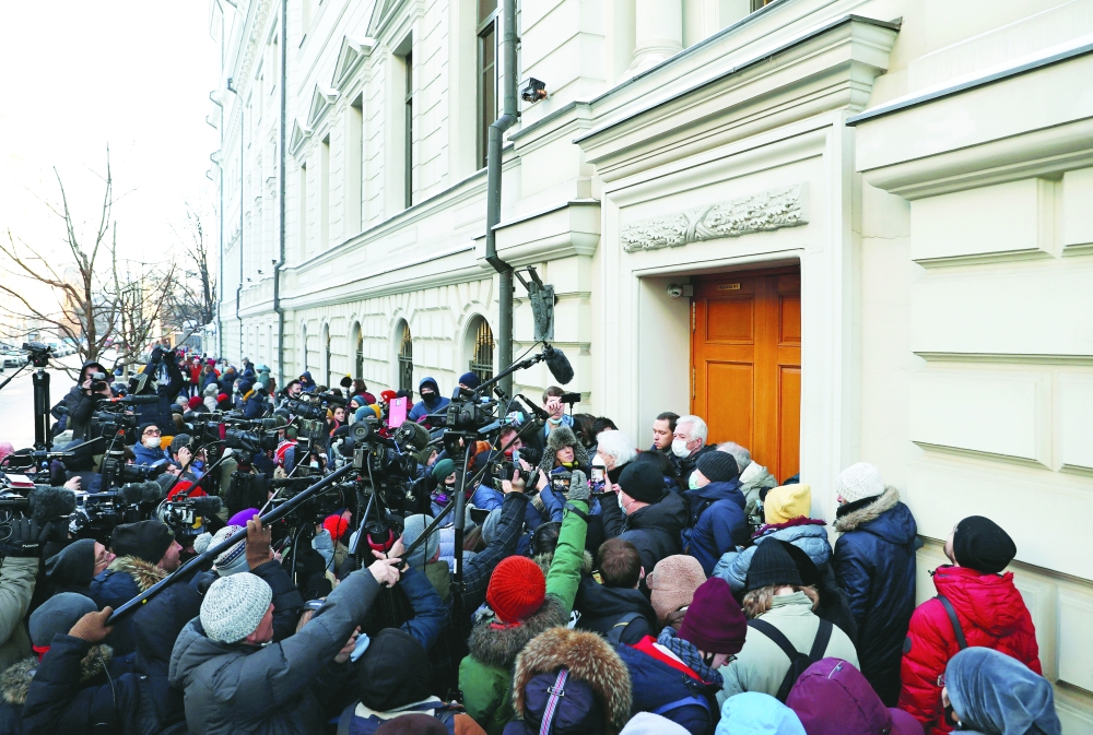 Supporters of the human rights group International Memorial and journalists gather outside a court building after a hearing of the Russian Supreme Court to consider the closure of International Memorial in Moscow, on Tuesday. - Reuters