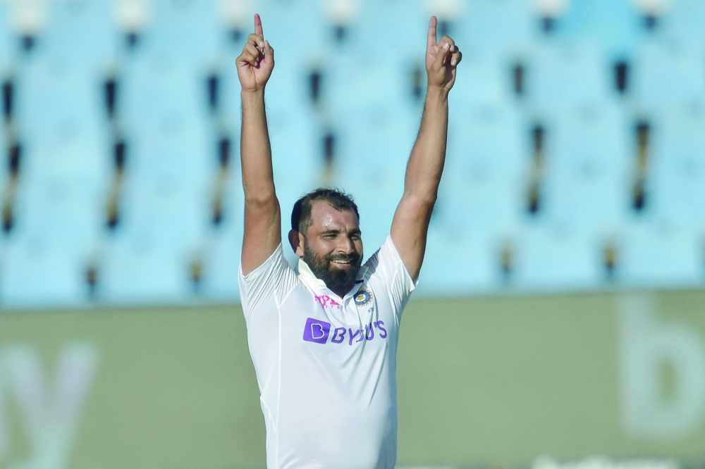 India's Mohammed Shami celebrates after the dismissal of South Africa's Kagiso Rabada (not seen) during the third day of the first Test in Centurion. -- AFP
