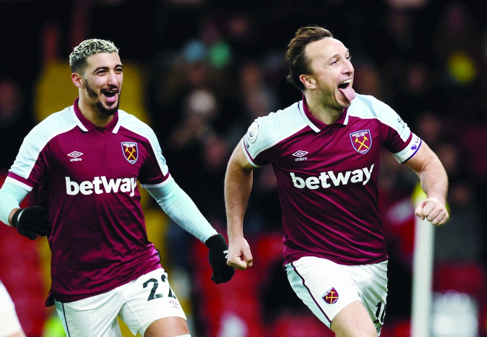 West Ham United's Mark Noble celebrates scoring their third goal with Said Benrahma. -- Reuters