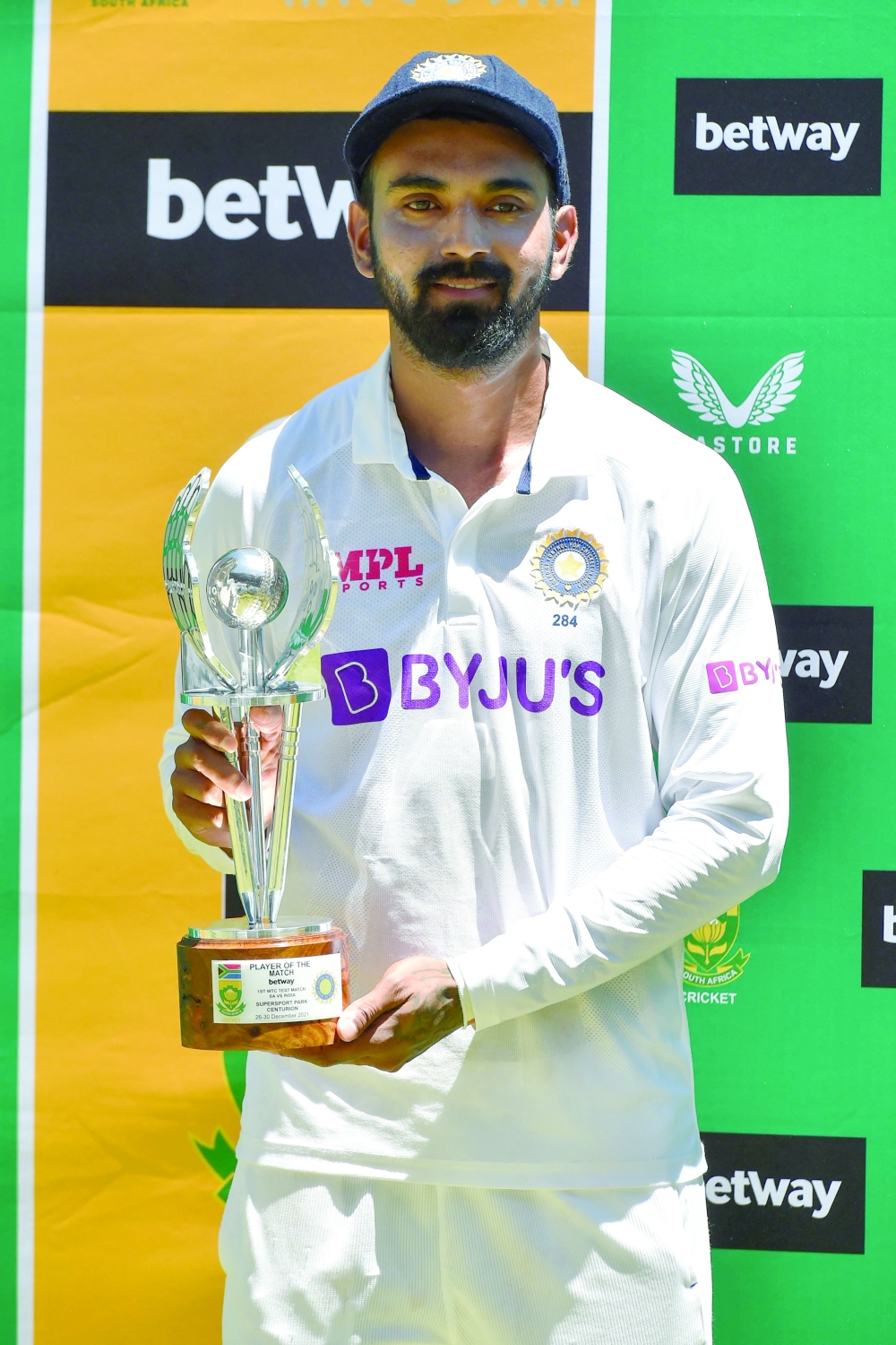 India's KL Rahul poses for a photograph with his trophy after being awarded man-of-the-match after the fifth day of the first Test. -- AFP