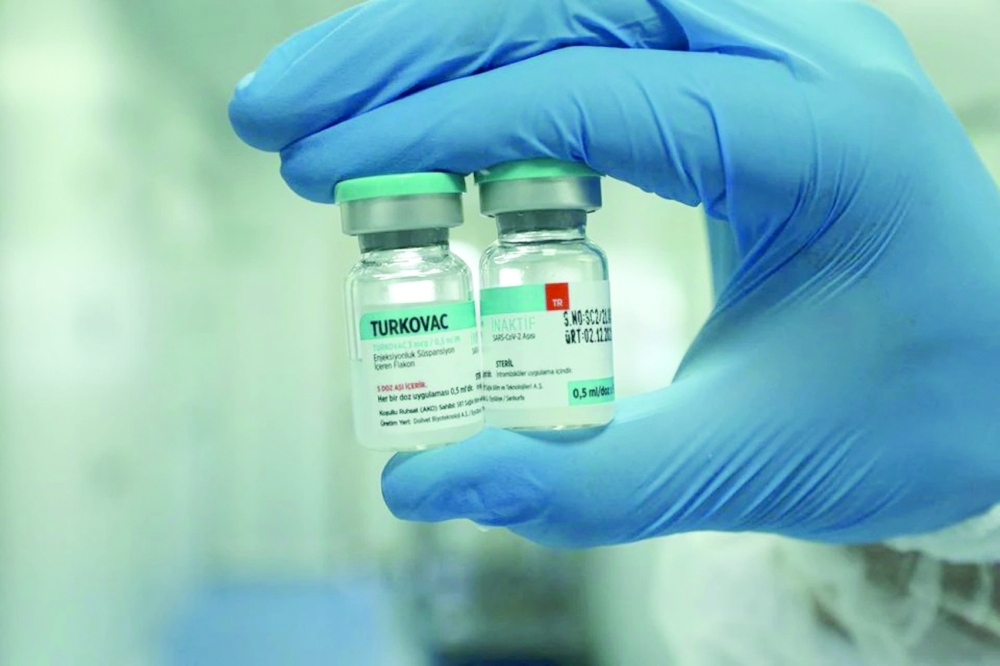 A health worker holds vials of Turkey's domestically developed Turkovac Covid-19 vaccine at the vaccine's manufacturing facility in Sanliurfa.