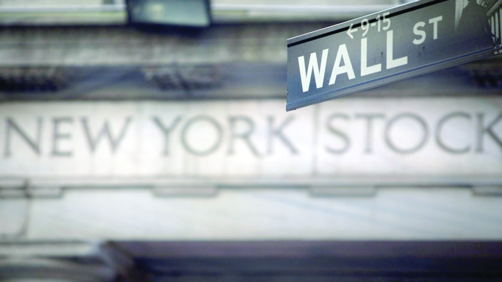 FILE PHOTO: FILE PHOTO: A Wall Street sign outside the New York Stock Exchange