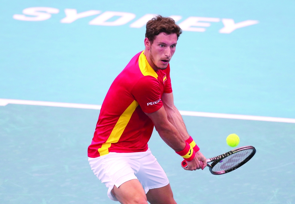 Spain's Pablo Carreno in action during his group stage match against Chile's Alejandro Tabilo. -- Reuters