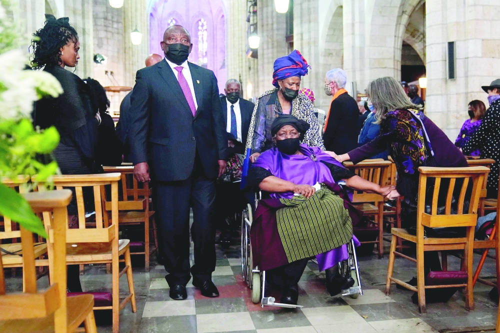 South African President Cyril Ramaphosa (L) and Leah Tutu (R), widow of Archbishop Desmond Tutu, leave the Cathedral after the requiem mass of Tutu at St George Cathedral in Cape Town on Saturday. - AFP