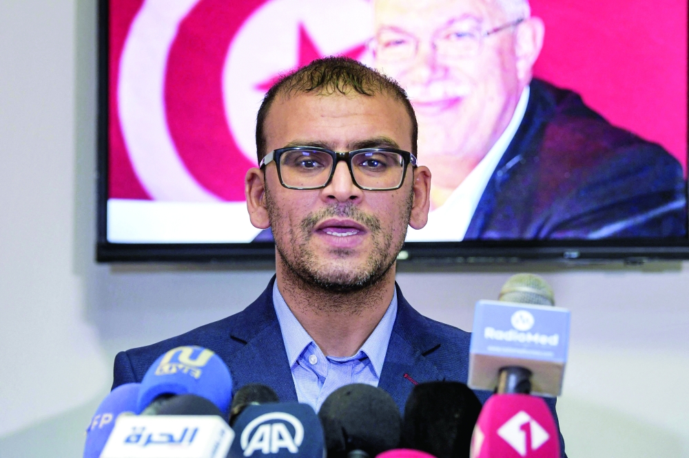 Abdelfattah Taghouti, member of the political bureau of Tunisia's Ennahdha, speaks to journalists after the arrest of the party deputy president, in Tunis on Friday. — AFP 