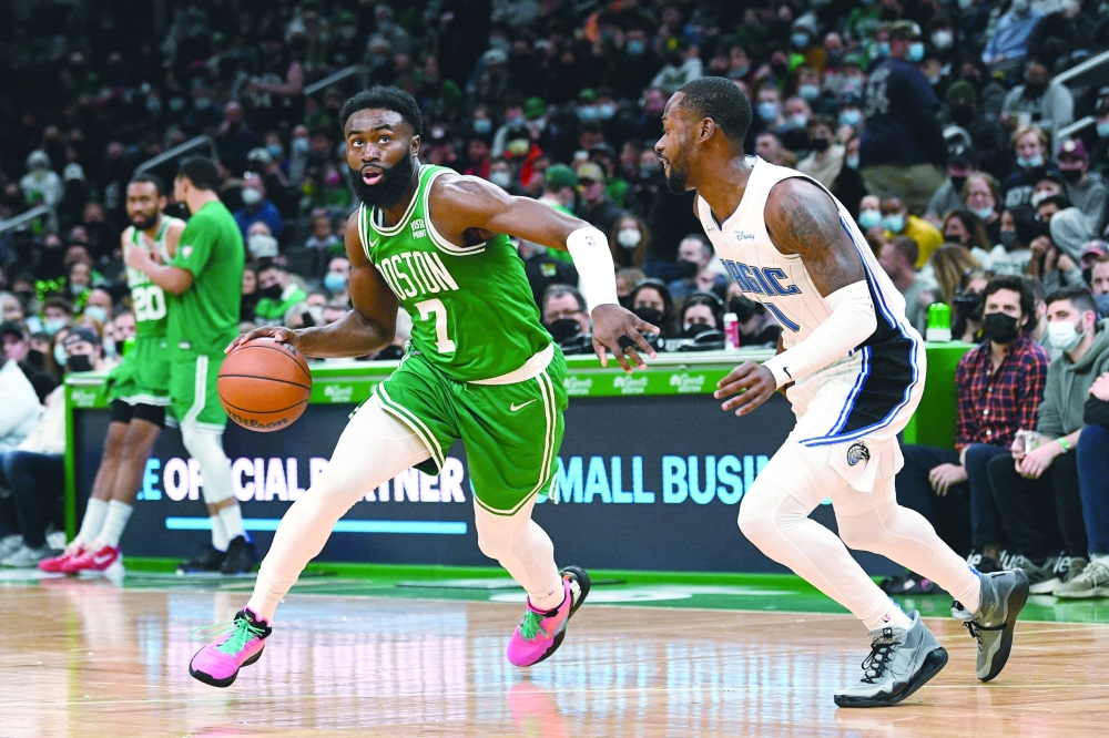 Boston Celtics guard Jaylen Brown (7) drives to the basket against Orlando Magic guard Terrence Ross (31) during the first half at the TD Garden. -- USA Today Sports
