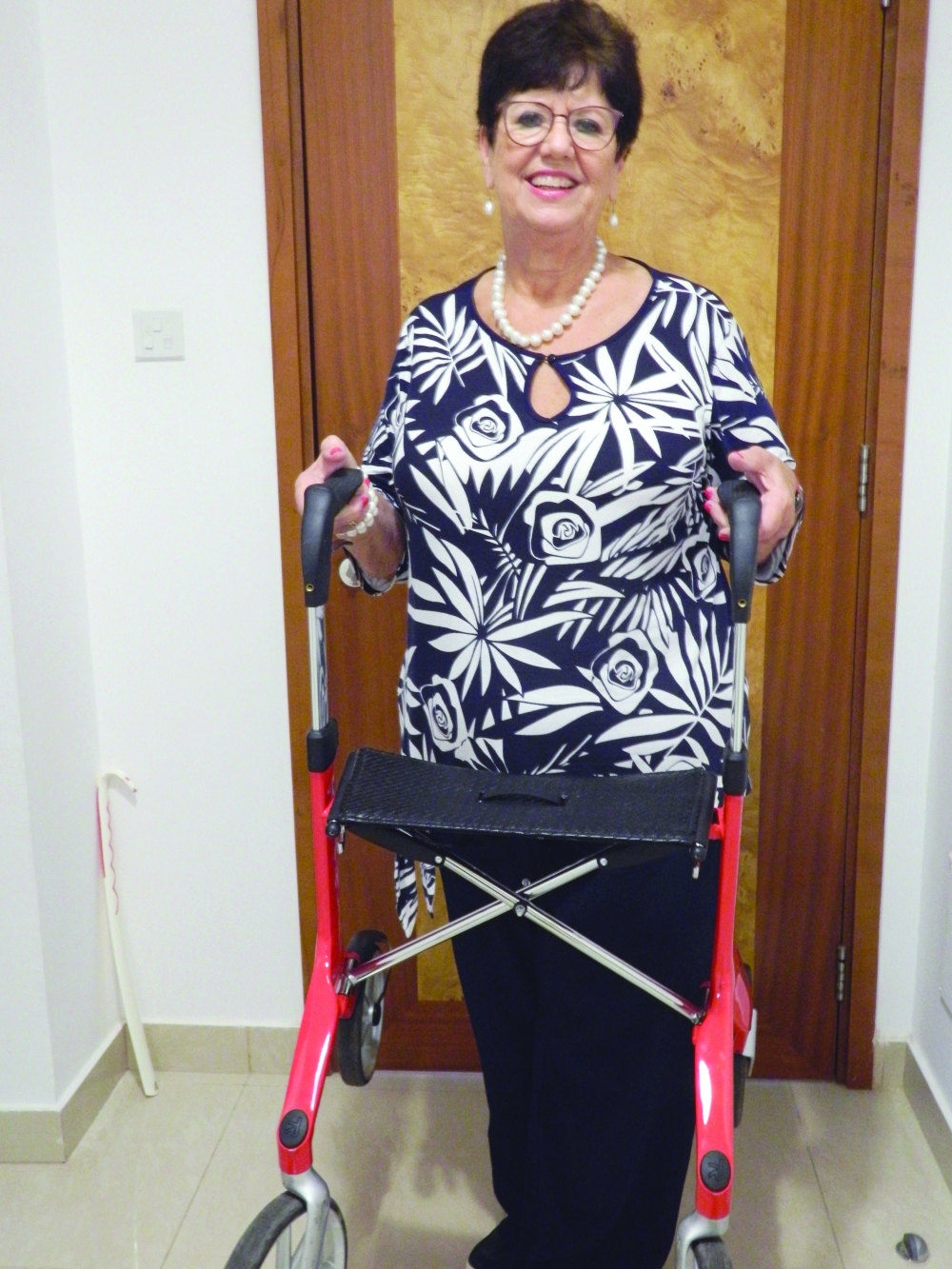 Elly Hollemans holds her walker