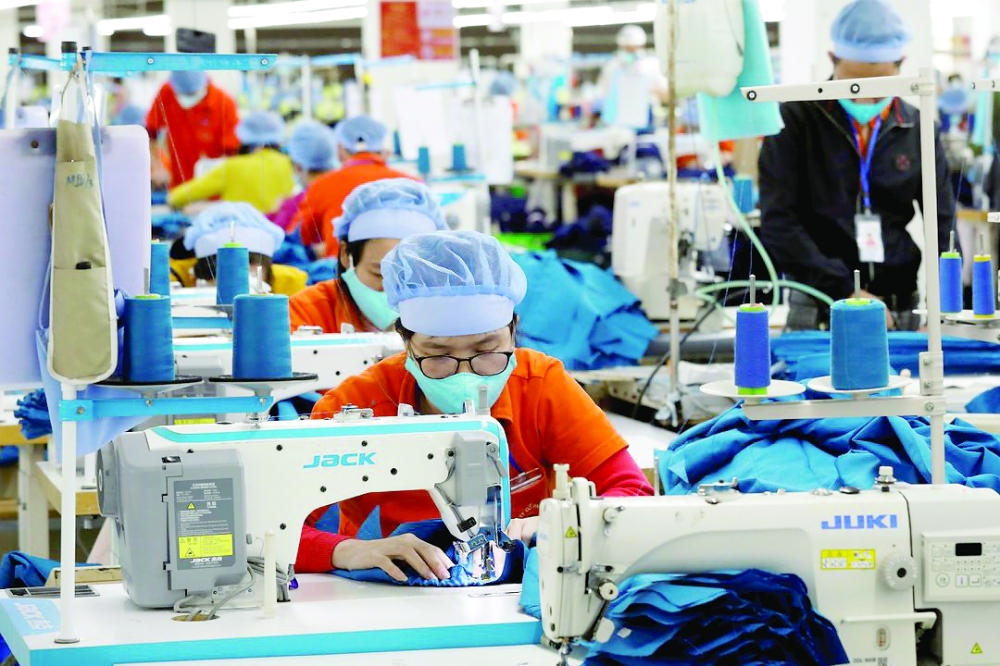Labourers work at Hung Viet garment export factory in Hung Yen province, Vietnam.  — Reuters