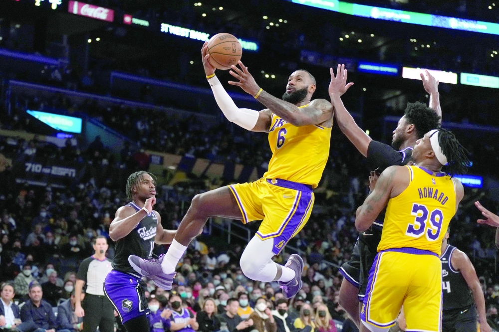 Jan 4, 2022; Los Angeles, California, USA; Los Angeles Lakers forward LeBron James (6) shoots the ball against the Sacramento Kings in the second half at Crypto.com Arena. Mandatory Credit: Kirby Lee-USA TODAY Sports
