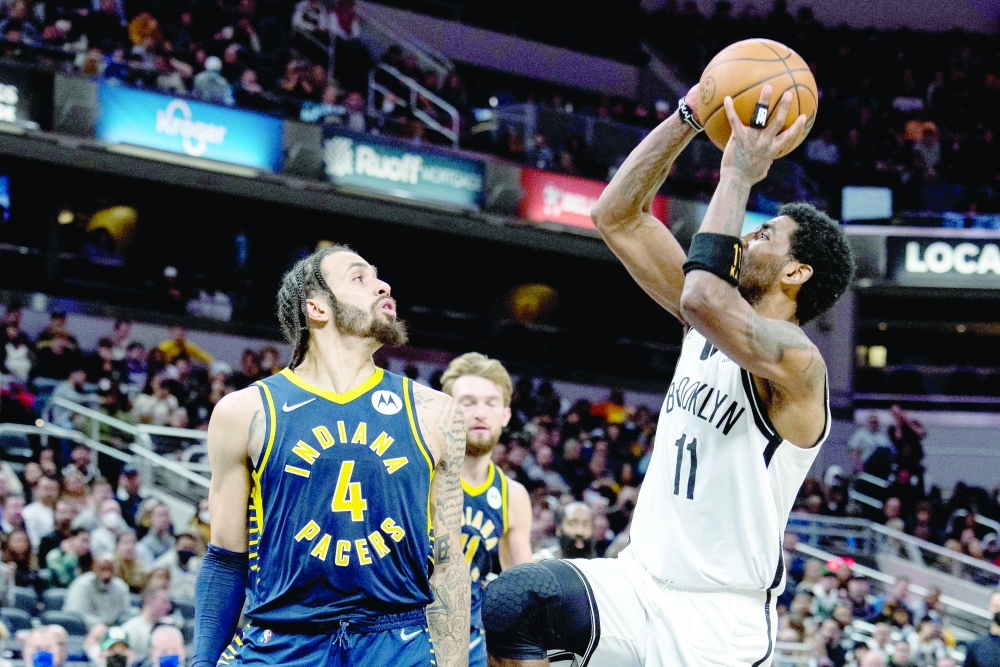 Brooklyn Nets guard Kyrie Irving (11) shoots the ball while Indiana Pacers guard Duane Washington Jr. (4) defends in the second half at Gainbridge Fieldhouse. -- USA Today Sports
