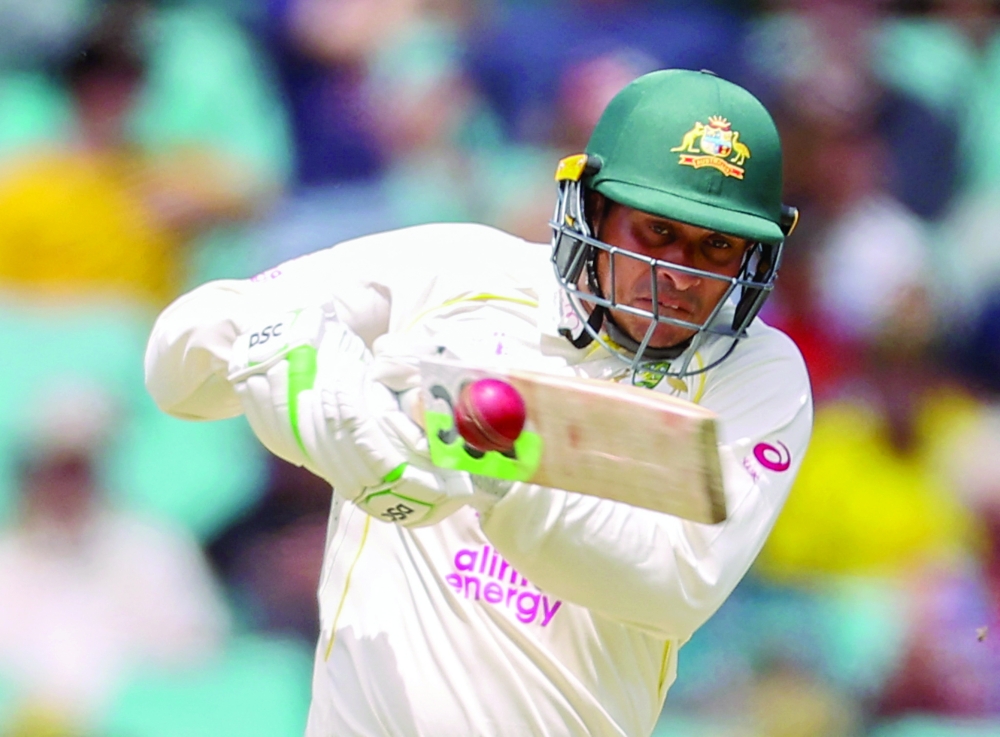 Australia's Usman Khawaja hits a shot on day two of the fourth Ashes Test against England at the Sydney Cricket Ground (SCG). -- AFP
