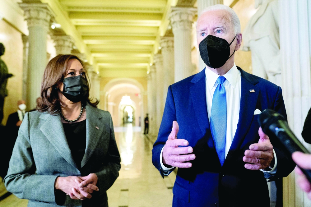 US President Joe Biden speaks to reporters in the Hall of Columns. -- AFP