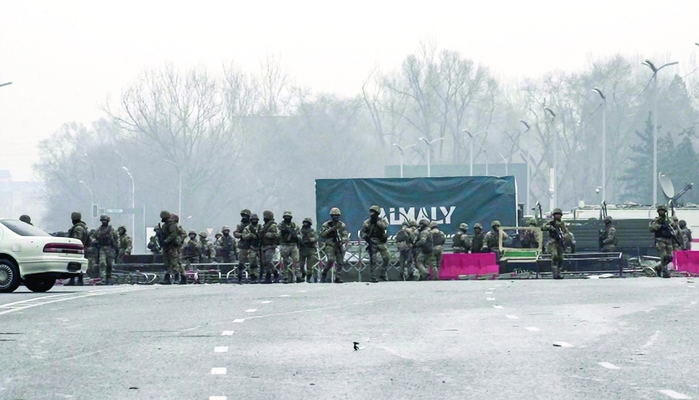Servicemen block a street in central Almaty on Friday, after violence that erupted following protests over hikes in fuel prices. - AFP 
