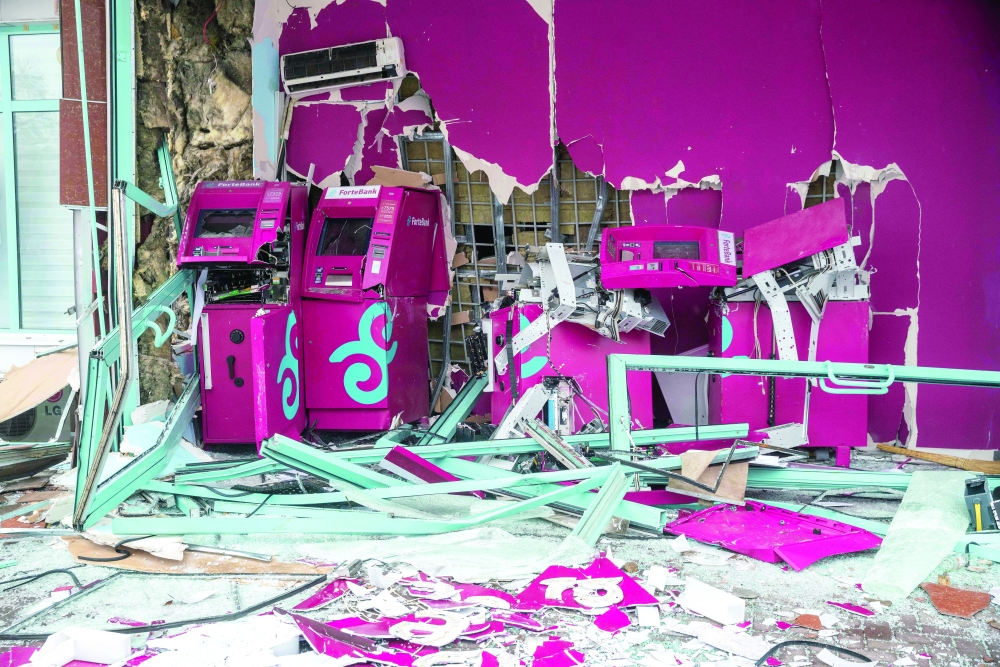 A destroyed bank in central Almaty on Saturday. - AFP 