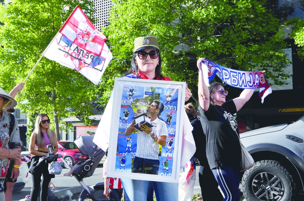 Members of the local Serbian community rally outside a government detention centre where Serbia's tennis champion Novak Djokovic is staying in Melbourne. -- AFP
