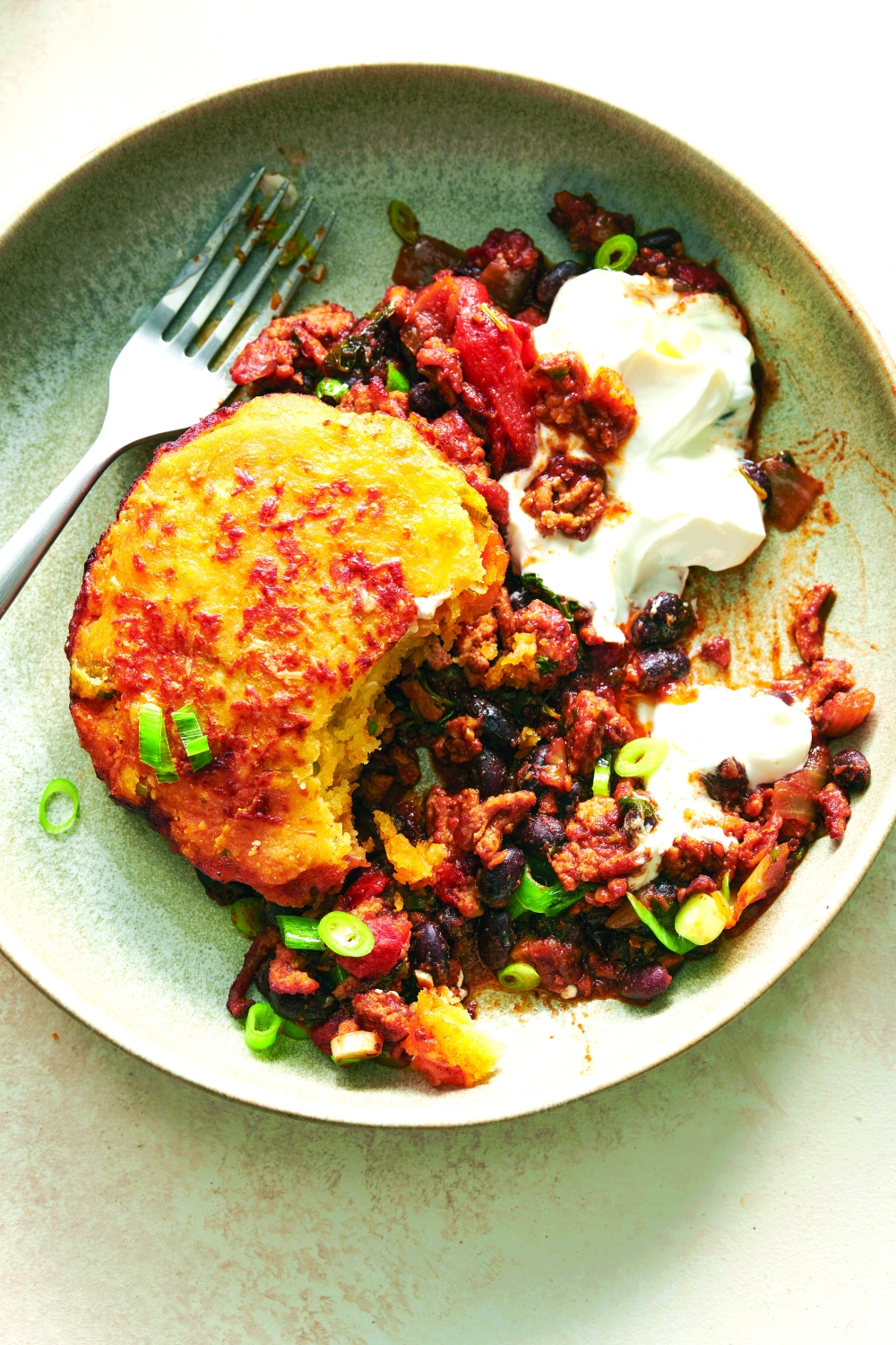 Biscuit-topped turkey chili in a cast-iron skillet. (David Malosh/The New York Times; Food Stylist: Simon Andrews)