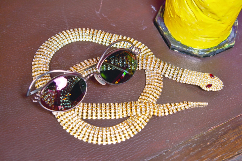 Jean Paul Gaultier eyebrow sunglasses from the 1990s and a Dolce & Gabbana snake belt from 2000 at Aralda Vintage in Los Angeles, Jan. 3, 2022. (Michelle Groskopf/The New York Times)