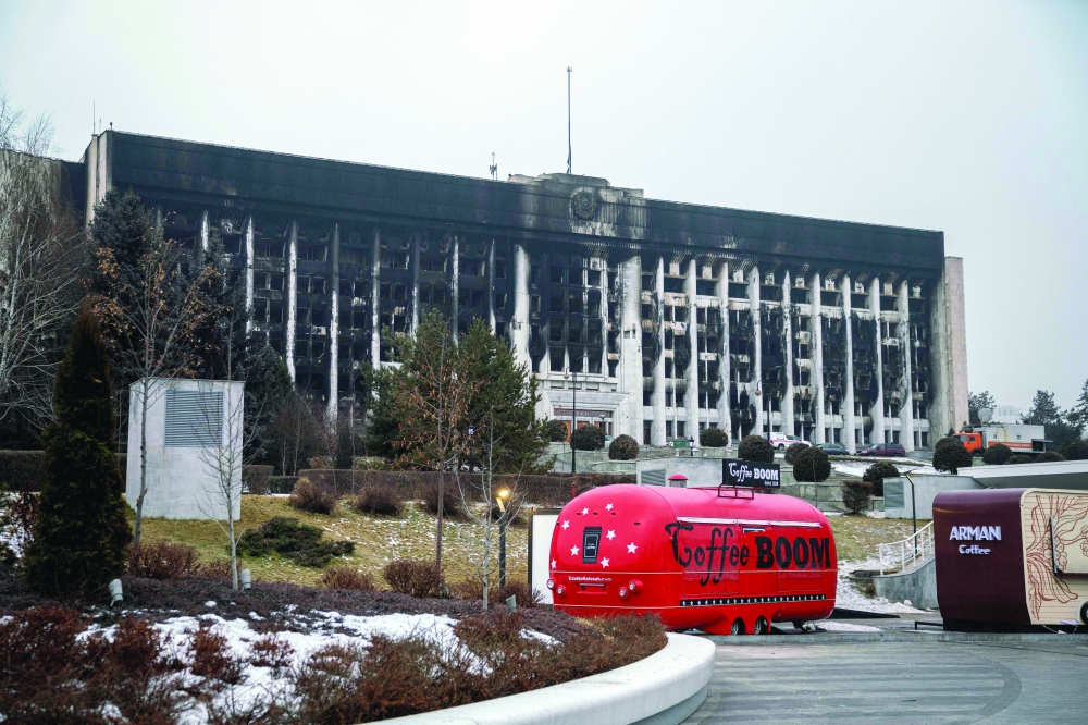 A general view of a burnt-out Almaty City Administration building in central Almaty, following violent protests over the price increase of the fuel. - AFP
